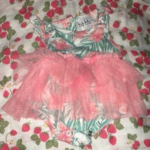 Inside with a pink tutu attached